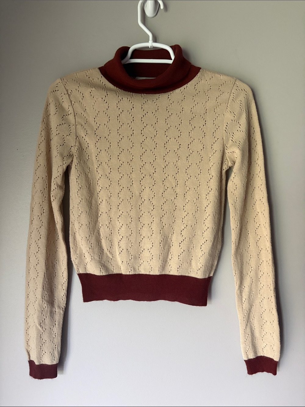 ASOS Women’s cream-colored pointelle knit turtleneck sweater